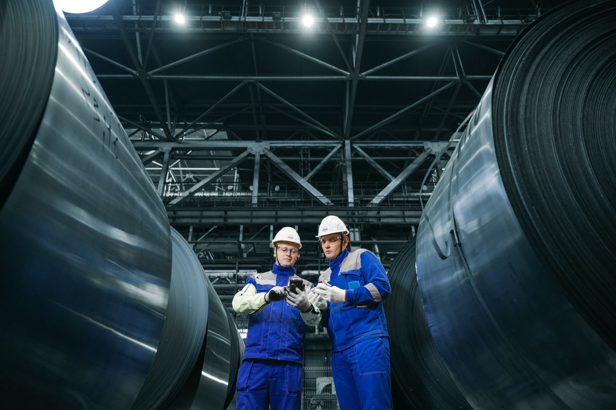 Illustrative stock photo of professionals inspecting equipment at an industrial facility
